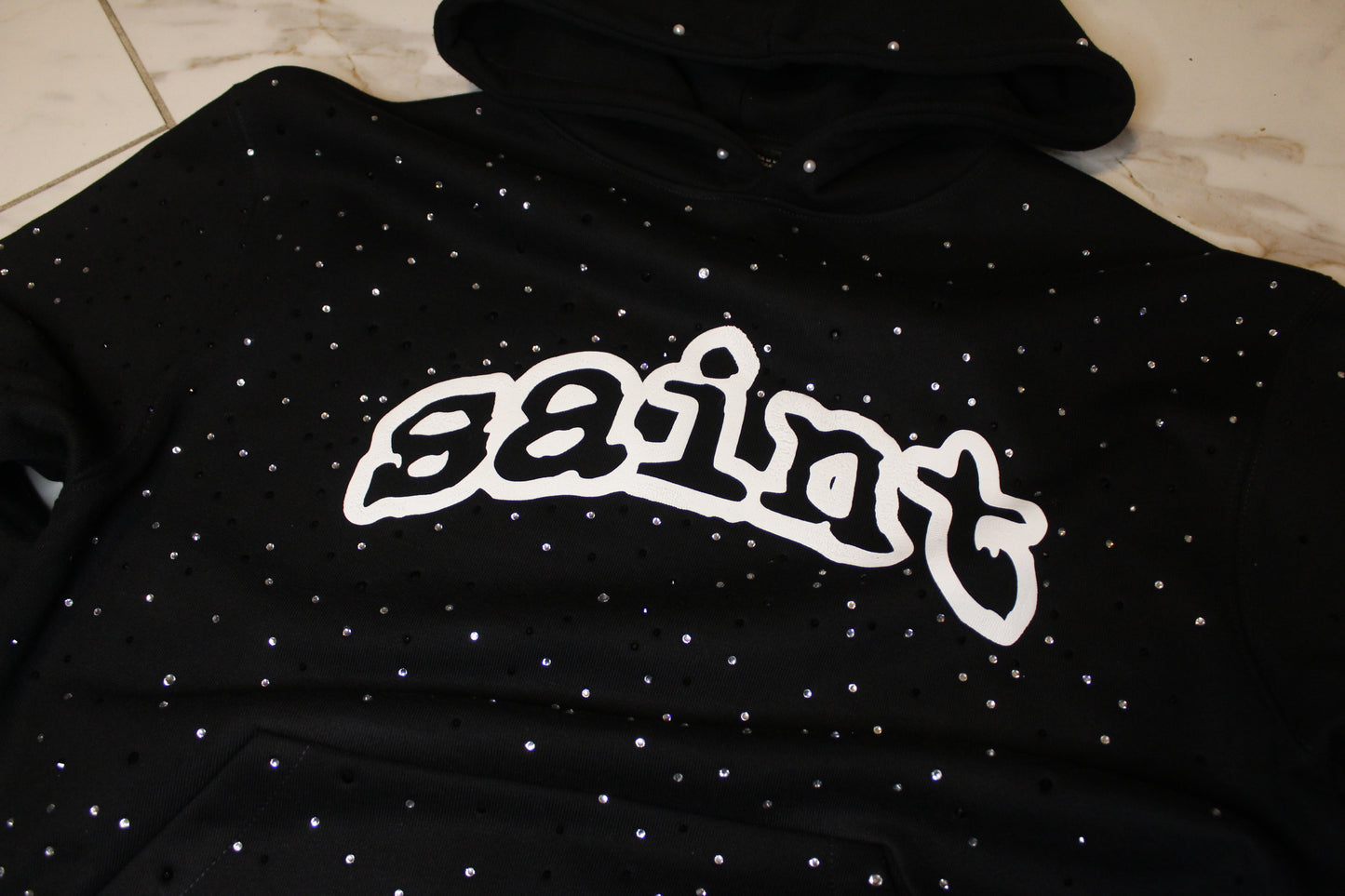 “saint” rhinestone pullover